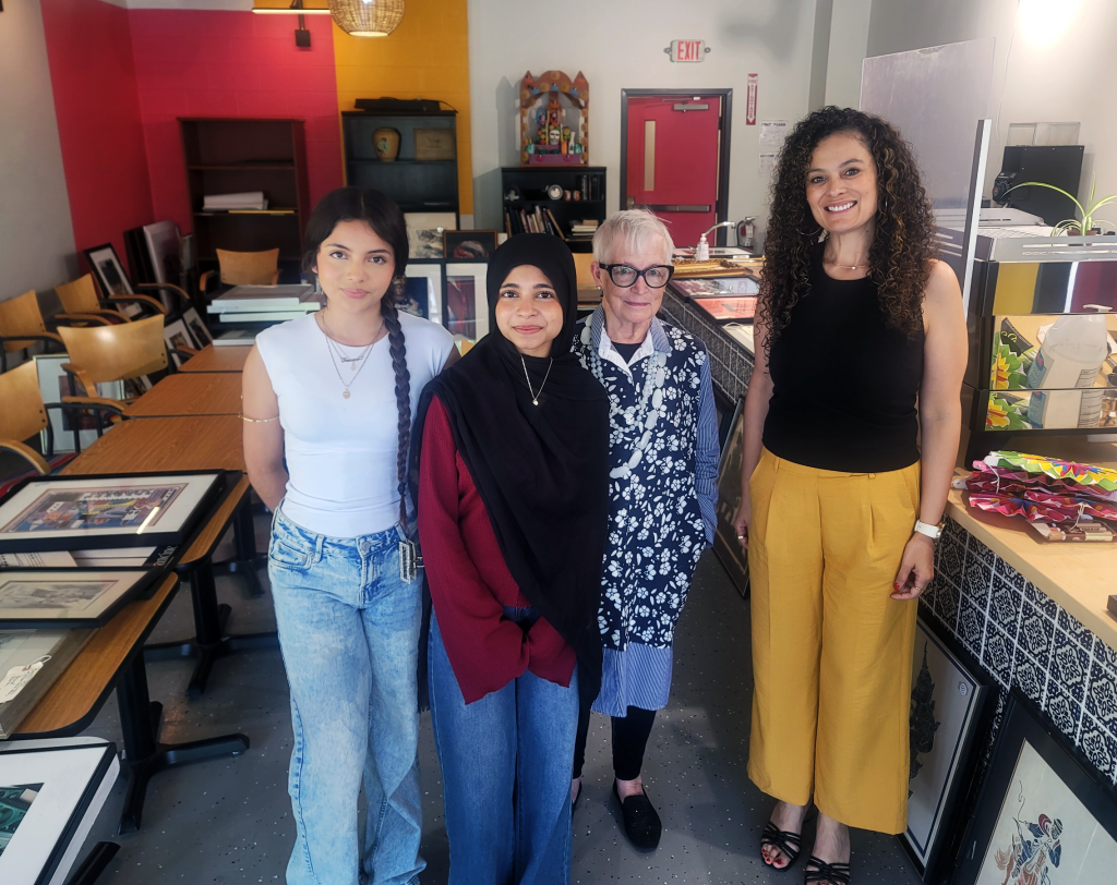 BAI interns and two adults in gallery space.