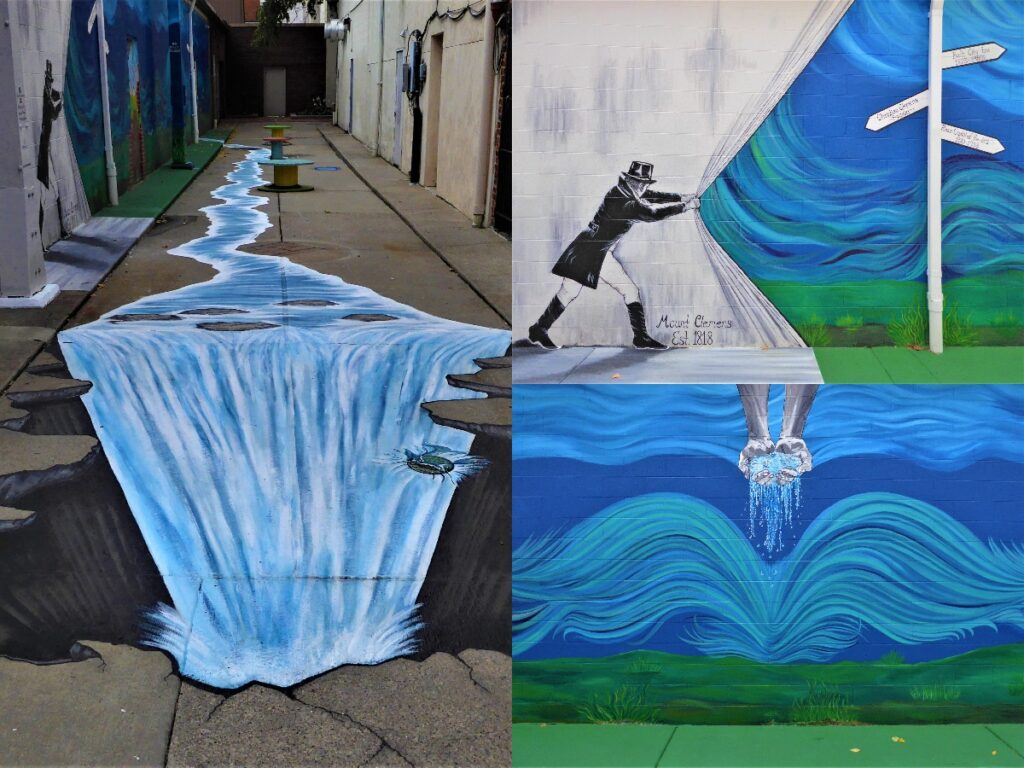 A photo of a mural about water that pours off onto the street and is painted onto the sidewalk and then turns into a waterfall.