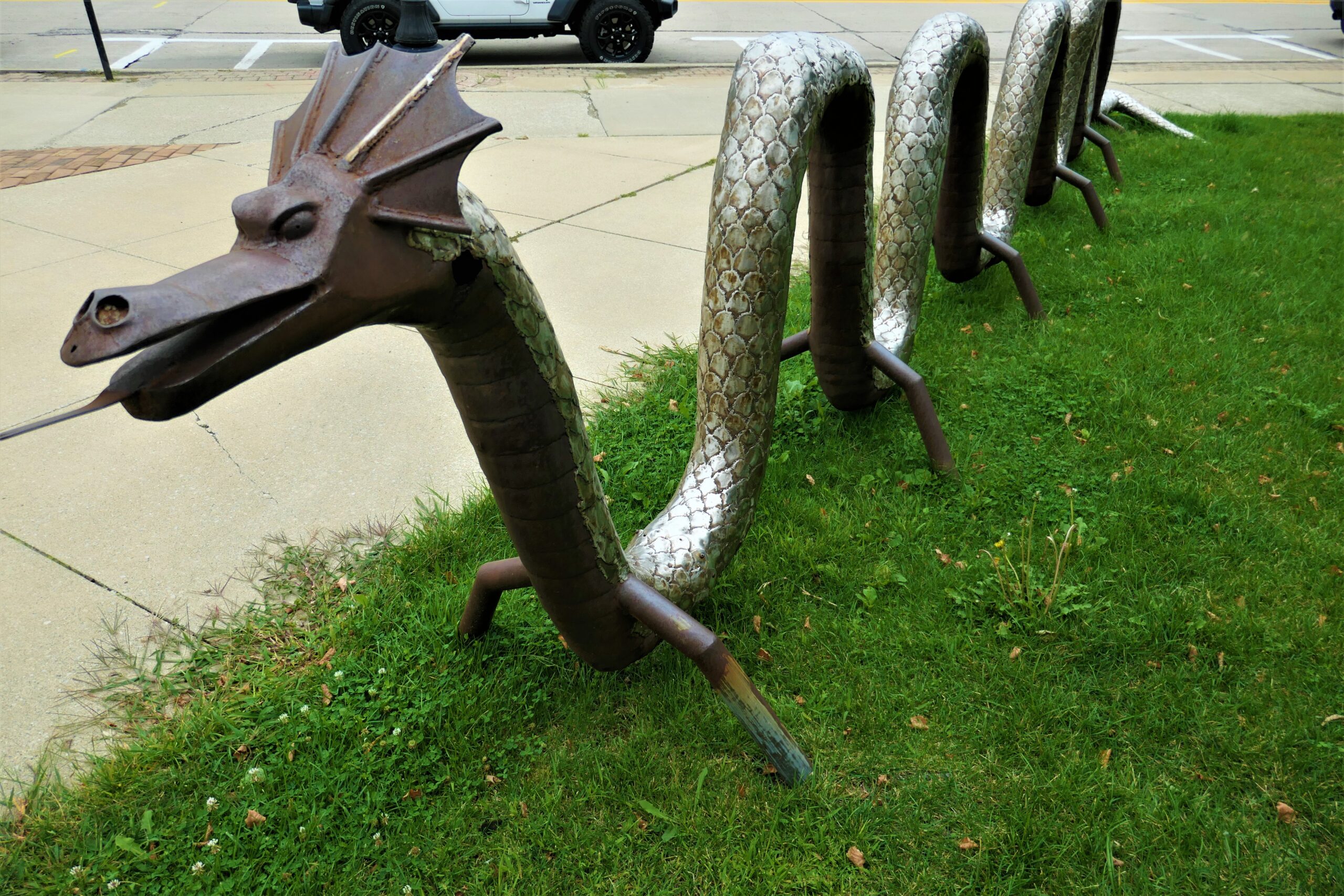 Photo of a sculpture of a twisty sea serpent with its tongue sticking out
