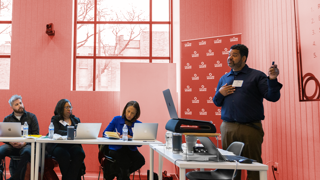 An instructor leading a lesson in a conference room